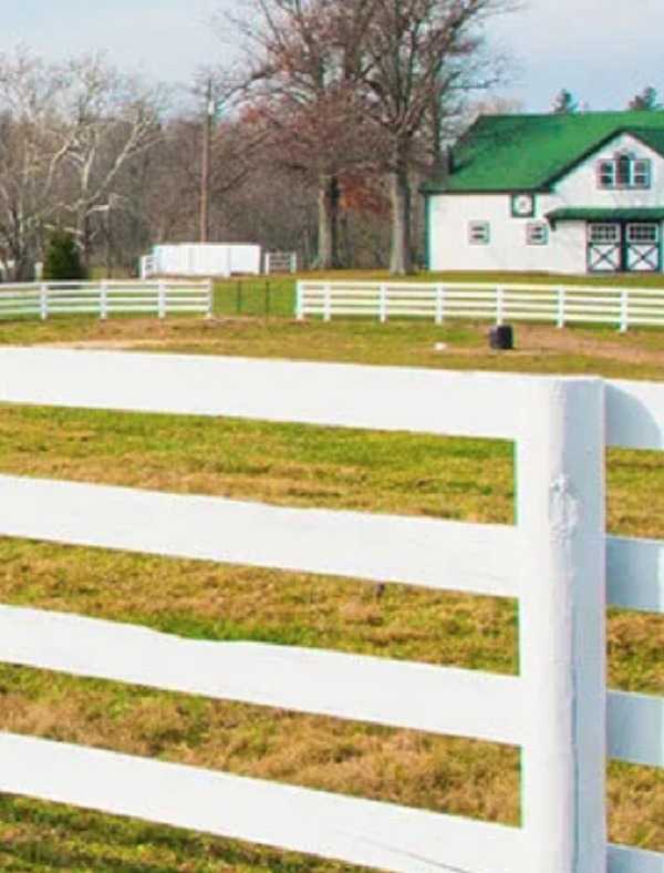 white fencing that is being used for a pasture